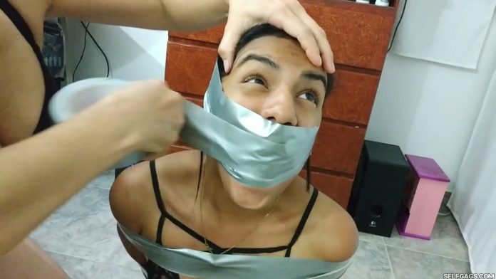 Duct taped teenage girl in bondage gagged by her mom