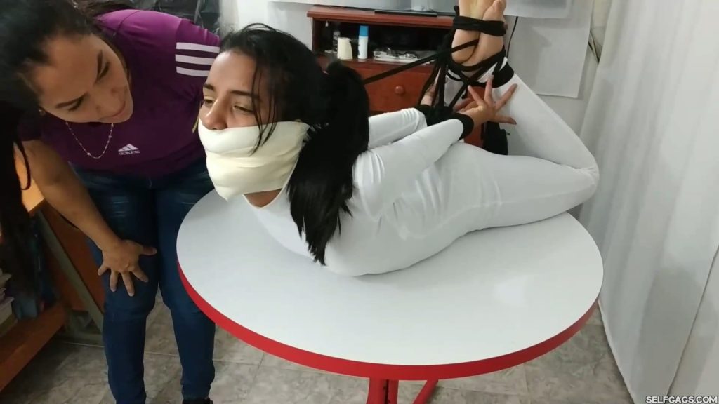 Barefoot bondage girl gagged in tight hogtie