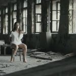 Barefoot girl tied to a chair and duct tape gagged in old warehouse