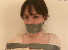 Busty Bondage Dane Trapped In Tape Busty girl annoyed to be bound