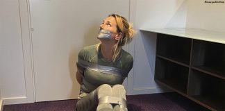 Danish Fitness Girl In Tape Bondage A Danish girl is bound and gagged on the floor