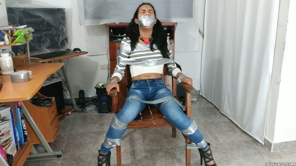 Duct tape gagged girl in bondage