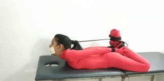 This Psychiatrist Is Using Bondage As Medicine Girl in red bodysuit hogtied and gagged