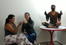 BDSM girl used as human furniture