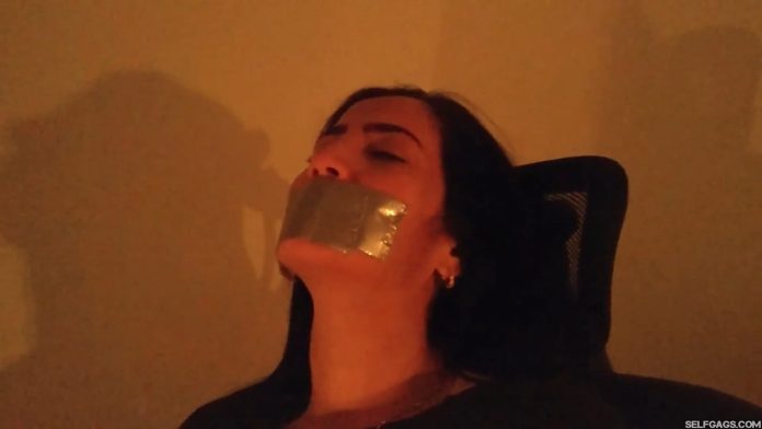 Duct tape gagged milf