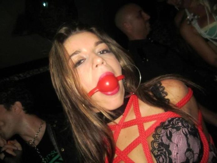 Collared girl with ballgag in her mouth