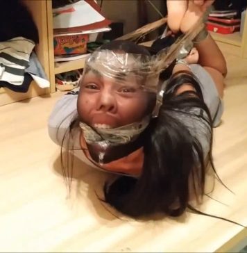 Fucked Up With Pantyhose And Extreme Hogtie! Pantyhose encased girl barefoot and gagged in extremely strict hogtie