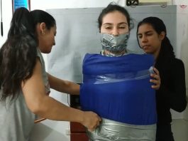 Collared And Pantyhose Hooded In Multilayered Mummification Bondage Gagged girl encased in sleeping bag and duct tape