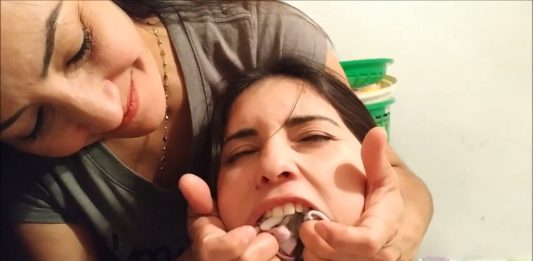 Girl Has 6 Socks Stuffed In Her Mouth Girl has her mouth stuffed with socks by mom
