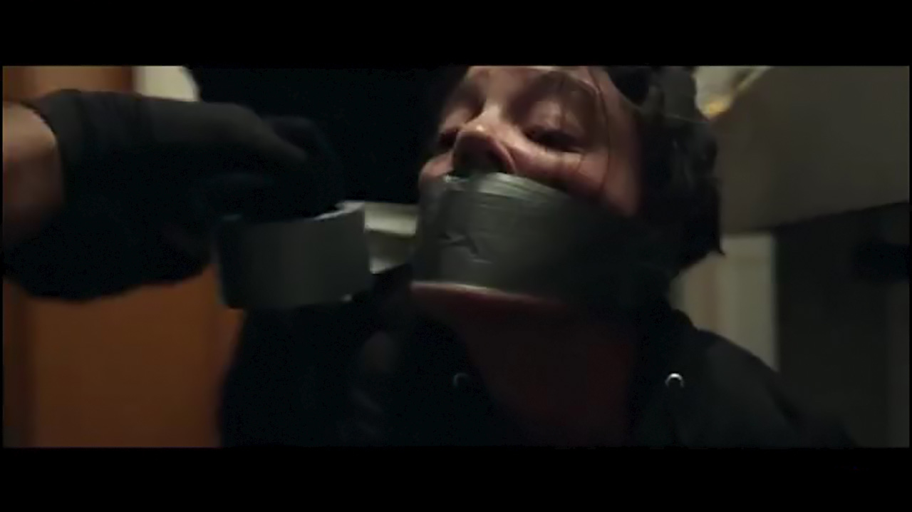 Woman duct tape gagged tight