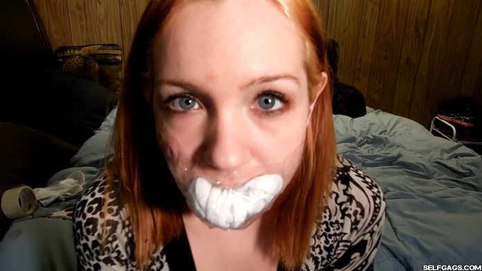 College girl self gagged with socks and clear tape