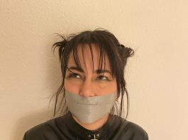 Straitjacketed Cheerleader Tape Gagged Tape gagged brunette in straitjacket bondage