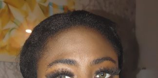 Black Beautiful Bitch In Rope Bondage – Ebony BDSM A black woman with green eyes is gagged with silver duct tape in a living room