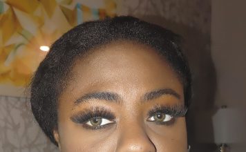 Black Beautiful Bitch In Rope Bondage – Ebony BDSM A black woman with green eyes is gagged with silver duct tape in a living room