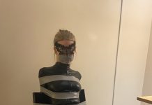 Blonde catsuit burglar in tape bondage