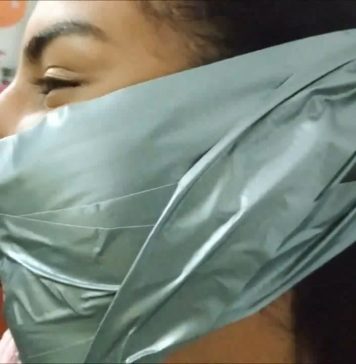 Little Girl Silenced With BIG Tape Gag! A beautiful girl is wearing a big tape gag