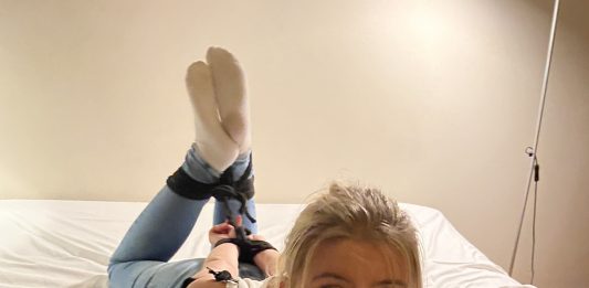 Tied Up In White Socks And Tight Jeans Beautiful blonde girl hogtied in jeans and white socks while gagged with black duct tape