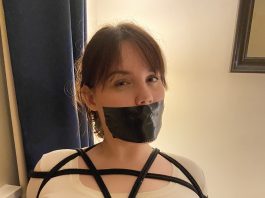 Undercover Agent Chest Harnessed & Tape Gagged Chest harnessed bondage woman with big tits is gagged with black tape