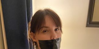 Undercover Agent Chest Harnessed & Tape Gagged Chest harnessed bondage woman with big tits is gagged with black tape