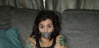 Tattooed Woman In Tape Bondage Tattooed woman in tape bondage
