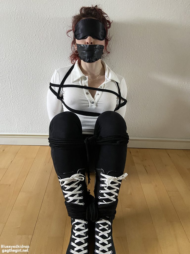Alexis Luna bound and gagged in jeans and sneakers