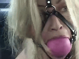 Blonde With Giant Ballgag Harness – Bondage GIF Blonde Captive Wearing Giant Ballgag - bondage gifs