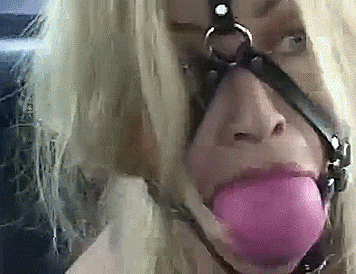 Blonde With Giant Ballgag Harness – Bondage GIF Blonde Captive Wearing Giant Ballgag - bondage gifs