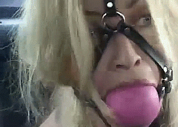 Blonde With Giant Ballgag Harness – Bondage GIF Blonde Captive Wearing Giant Ballgag - bondage gifs