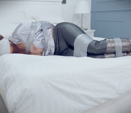 Boss Lady Jacqui Ryland Bound And Gagged Boss lady Jacqui Ryland in bondage wearing tight leather pants and sexy long boots