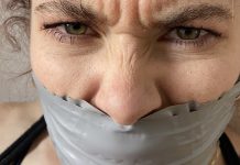 Mad woman gagged with tape