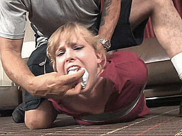 A bondage gif showing a feisty woman angry about getting gagged