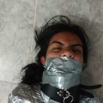 Collared girl heavily gagged with real duct tape