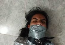 Collared girl heavily gagged with real duct tape