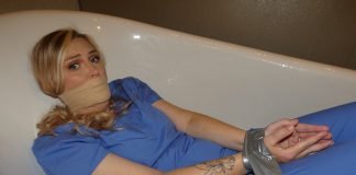 Kidnapped Nurse Tape Bound in the Tub Tape-tied-nurse-kidnapped-gagged