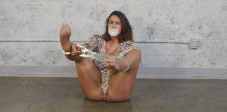 Megan Jones Gagged & Trapped in Heavy Steel Stocks Gagged woman locked in cuffs wearing pantyhose and snakeskin clothes