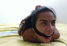 Hogtied girl cleave gagged with rope in strict hogtie