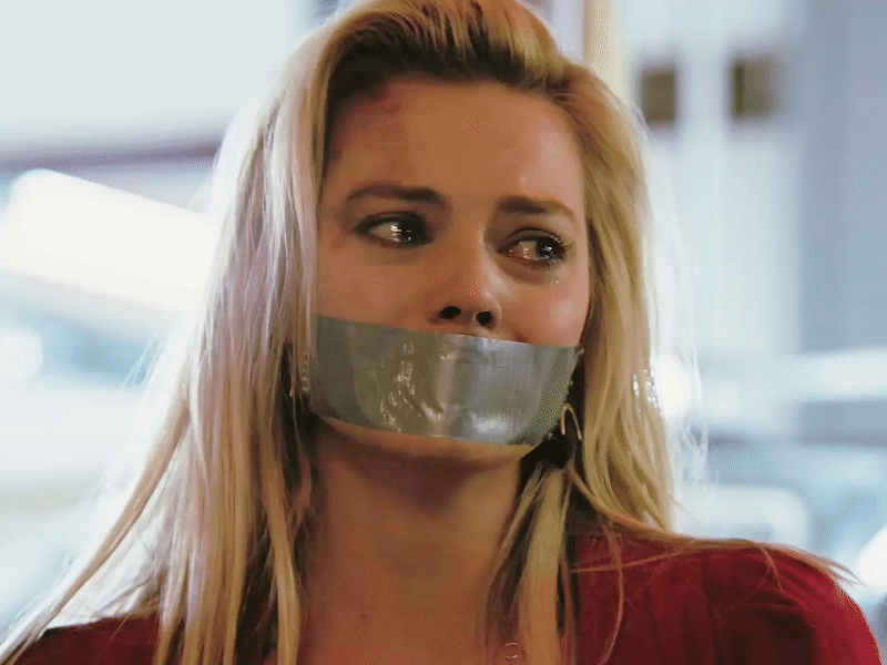 Margot Robbie tape gagged and crying