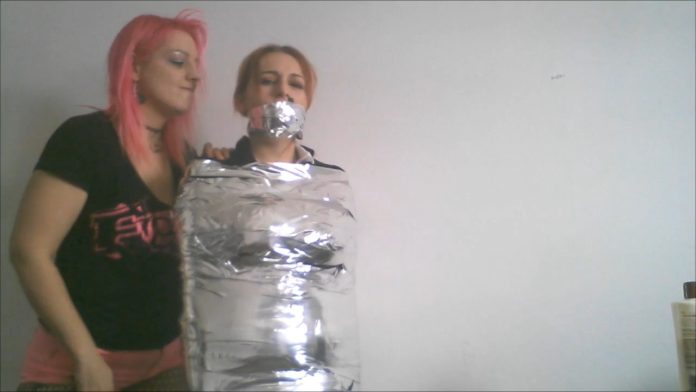 Mummified and bound with shiny duct tape