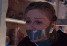 A gif showing actress Kirsten Dunst bound and gagged in the movie Small Soldiers