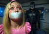 Terrified Birthday Girl Gagged, Facing Sadistic Punishment An 18-year-old birthday girl in a pink dress and party hat, duct tape gagged with tears streaming. A leather-clad sadist with a whip looms ominously.