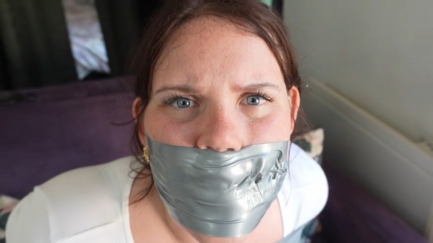 Snowflake from "FrenchBondage" looks helpless while duct tape gagged