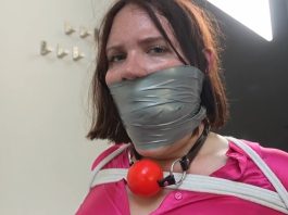 Snowflake the Secretary Bound and Gagged in Office Punishment – FrenchBondage Secretray Snowflake is tied to a chair and gagged with cloth and tape—bound and silenced in a strict office bondage scene.