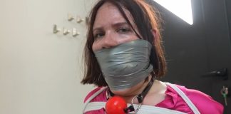 Snowflake the Secretary Bound and Gagged in Office Punishment – FrenchBondage Secretray Snowflake is tied to a chair and gagged with cloth and tape—bound and silenced in a strict office bondage scene.