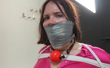 Snowflake the Secretary Bound and Gagged in Office Punishment – FrenchBondage Secretray Snowflake is tied to a chair and gagged with cloth and tape—bound and silenced in a strict office bondage scene.