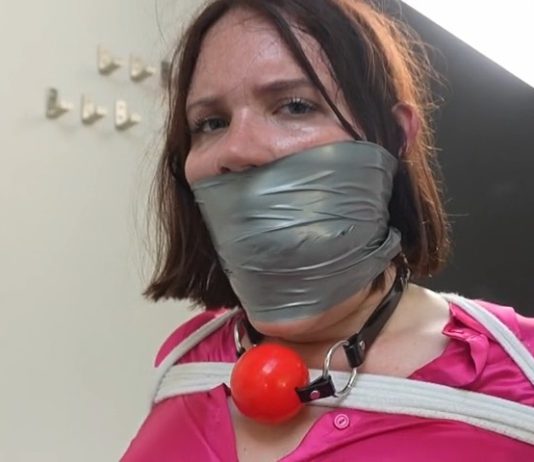 Snowflake the Secretary Bound and Gagged in Office Punishment – FrenchBondage Secretray Snowflake is tied to a chair and gagged with cloth and tape—bound and silenced in a strict office bondage scene.