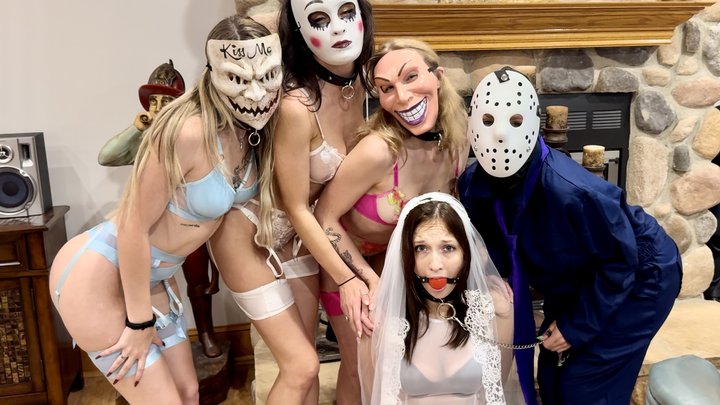 Natty Love gagged and restrained in a horror-themed Halloween bondage scene from Tied Tales.