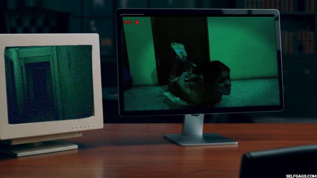 Gagged Diana motionless in darkness, hogtaped and silenced