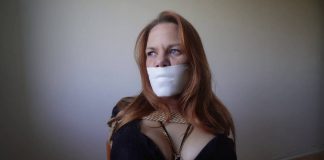 June Chair-Tied and Gagged With Microfoam – Blueeyedbondage Close-up of June’s tightly taped mouth with microfoam gag