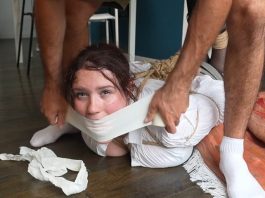 Snowflake Tightly Bound, Gagged, and Hogtied – FrenchBondage Snowflake gagged with microfoam tape, struggling on the bedroom floor