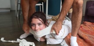 Snowflake Tightly Bound, Gagged, and Hogtied – FrenchBondage Snowflake gagged with microfoam tape, struggling on the bedroom floor